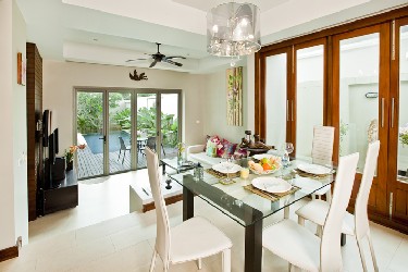 Living and dining Area with Garden and Pool View
